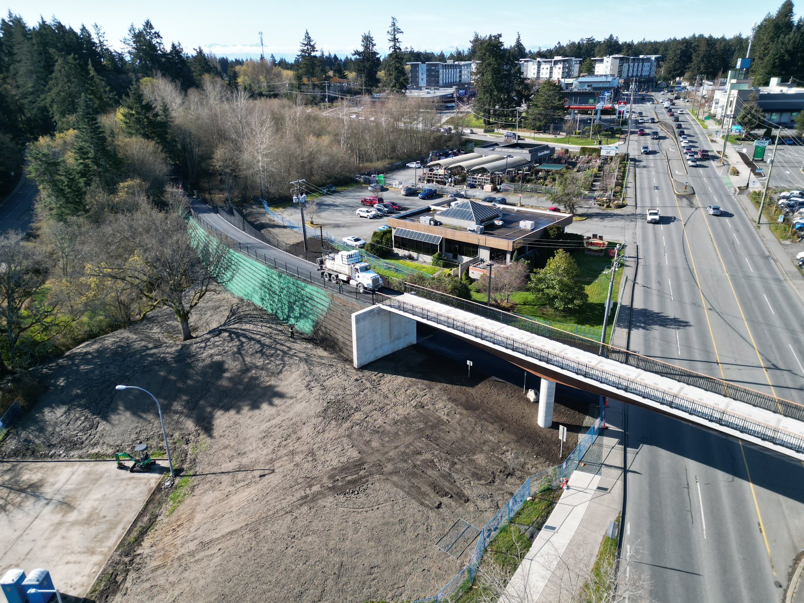 Aerial view of the Galloping Goose Pedestrian Overpass under construction in Colwood, BC, Canada.